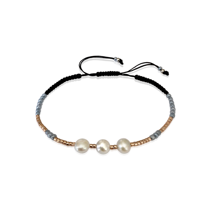 Adjustable handmade Bracelet braided with 3 beautiful Freshwater pearls and high quality gold glass pearls. The bracelet is straightforward and elegant with Gray pearls and black ribbon and gives endless possibilities to mix and match.